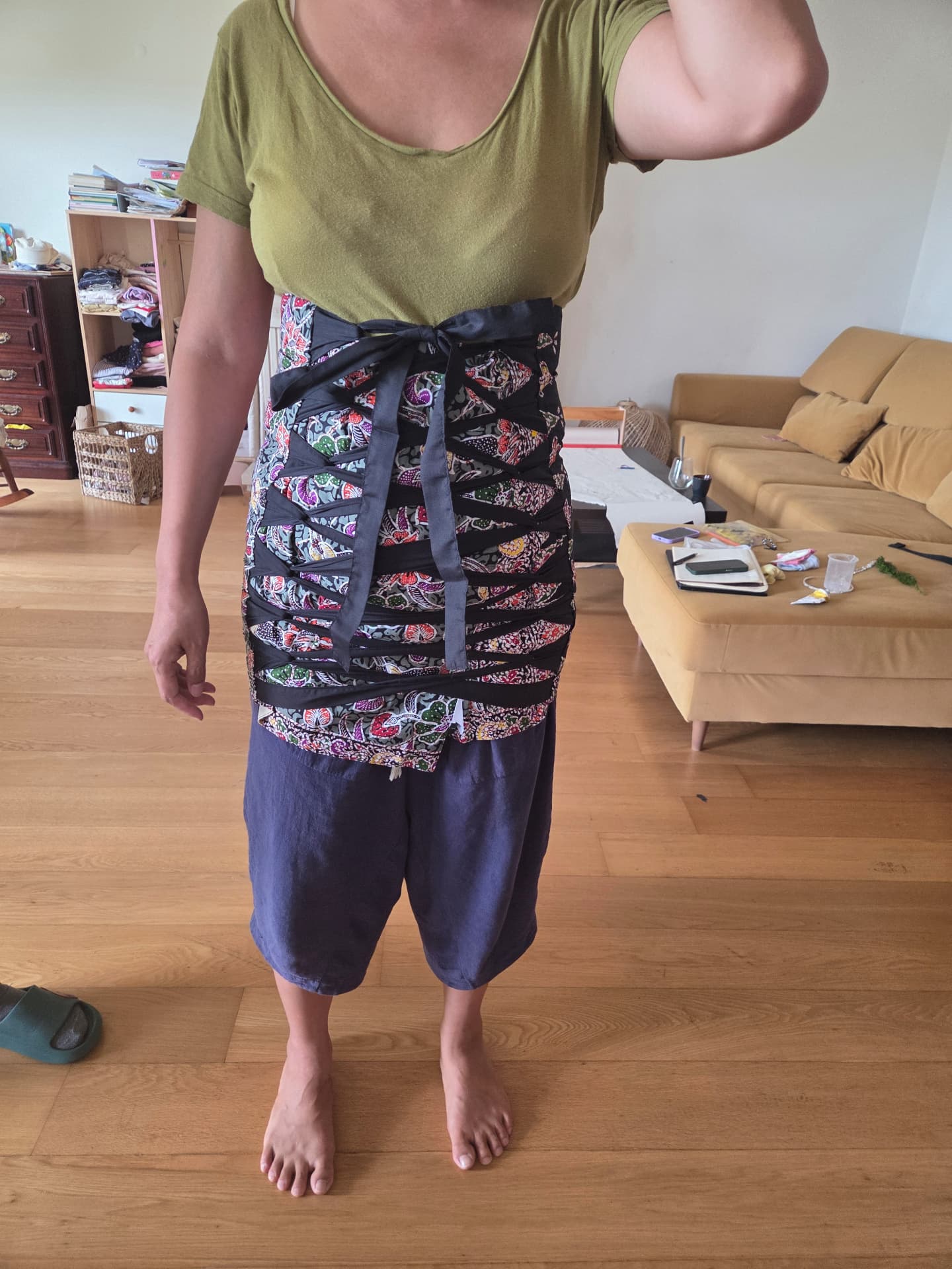 Qillian wearing a bengkung belly bind