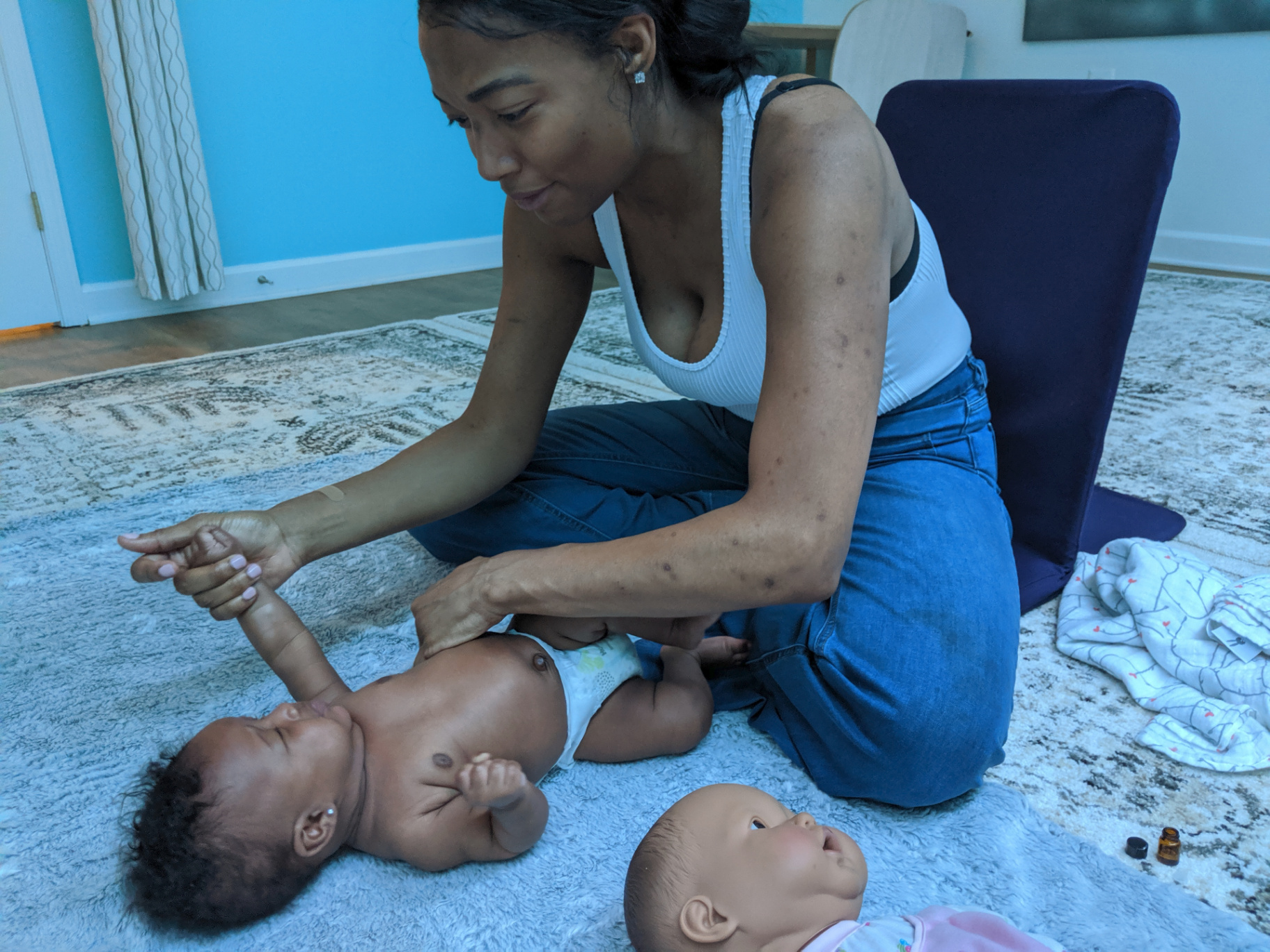 Mother massaging baby's arms