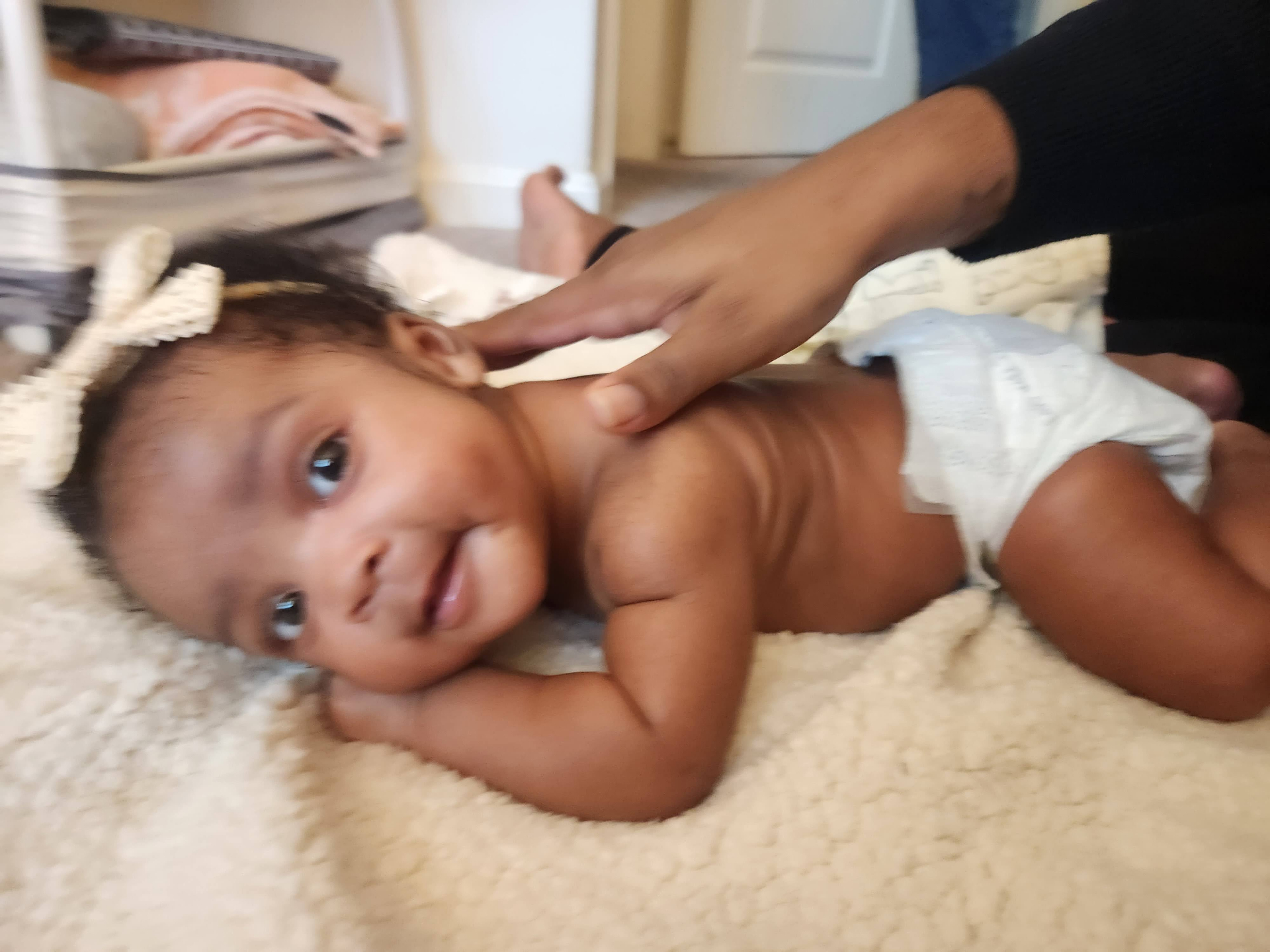 Smiling baby during massage